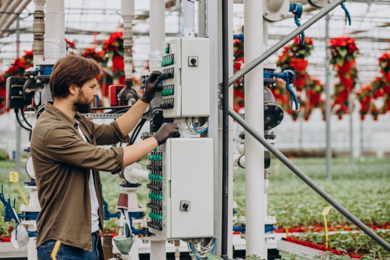 Man florist working in green house